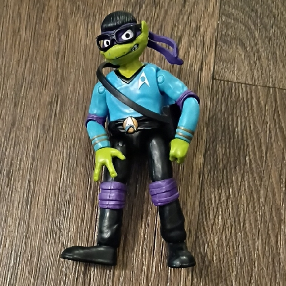 Green and Blue Action Figure with Purple Accents